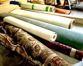 Large rugs in the garage, small rugs in the house