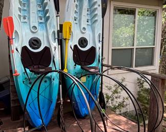 Kayaks, metal firewood racks.