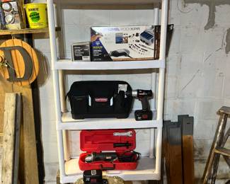 Paint sprayers, Dremel 4001 XPR, Craftman 20v drill with two batteries, charging station and bag, and Craftman  hand held electric grinder.