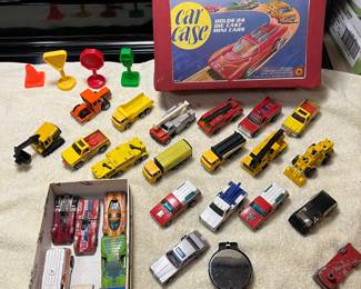Vintage 1970’s Tara toy M18 Matchbox Hotwheels red 24 car storage case with trays which are full of cars. Also, in the box are redline hotwheels. The picture also includes a vintage compass and several hot wheels sold separately.