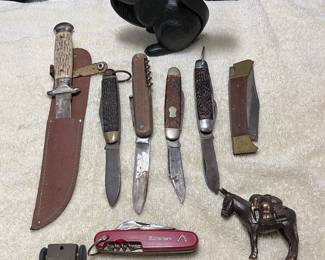 Pocket knives, steel horse and antique car.