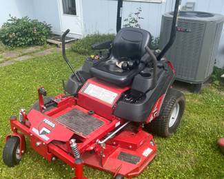 Ritter 0 turn mower with 652.5 hours. Includes hydraulic lift accessory to assist with cleaning .