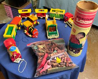 Lincoln logs and vintage Playschool vehicles.