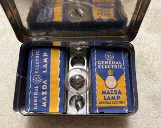 Mazda auto lamps inside of tin,