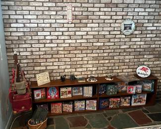 Large selection of puzzles, women’s purses and more.