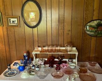 Depression glass, oval picture frames with the original glass, and cranberry glass.