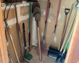 Large variety of lawn tools, including pitchforks, rakes, post hole, diggers, axes and shovels.