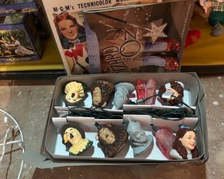 Advertising paper and Wizard of Oz figurines.