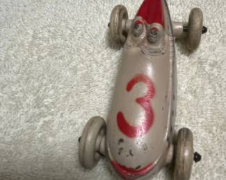 Vintage car from sun rubber company. The rubber is hard and the paint has some wear to it and the wheel spin freely.