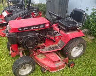 TORO wheel horse riding mower with airater attachment.