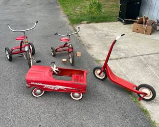 Vintage Murray tricycles, petal car and scooter.