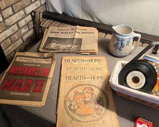 Vintage magazines and newspapers along with a Prince Albert tin and 45’s.