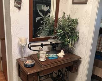 Antique Singer sewing machine with cabinet