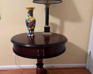 Round Table with Black Lamp Vase