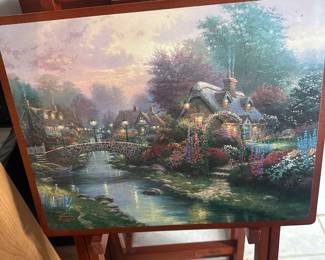 Multiple TV stands with beautiful paintings