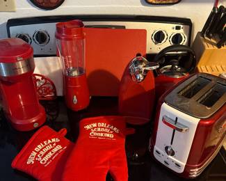 Red galore kitchen set! Pot holders, toaster, napkin holder, cutting boarding, smoothie maker, electric can opener, kettle, keurig, dish mat, and more!