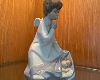 Lladro Porcelain Figurine Collection: Angel with Child designed by Juan Huerta and issued 1970 - 2003.