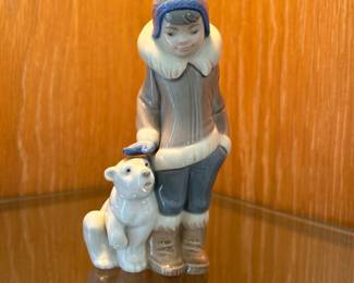 Lladro Porcelain Figurine Collection: Eskimo Boy with Pet, Inuit Boy with Polar Bear designed by Juan Huerta.