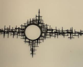 Mid Century brutalist metal wall sculpture titled "Some Distant World" by artist Corey Ellis