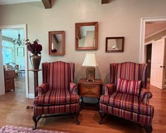 Pair of wingback chairs, brass lamp, rug