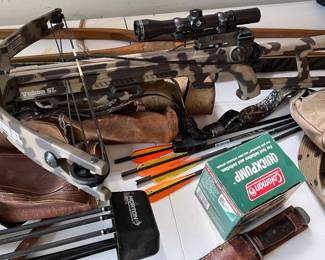 Crossbow, vintage bows, arrows. Hunting equipment.