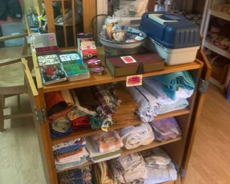 Linens and the desks matching cabinet
