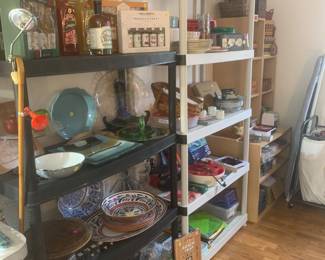 Shelves of kitchenware, glassware, baskets etc