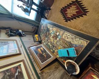 Coffee table (sold) with various lures and reels.