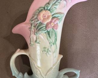 Hull Pottery cornucopia vase, likely from the Woodland series. These vases are known for their horn shape, floral designs, and soft colors.
Here's what's known about the Hull Pottery Cornucopia Vase:
Design:
It features a horn-like shape with molded flowers and leaves. The colors often include pastel shades of pink, yellow, and green.
Material:
It is made of ceramic pottery with a glossy glaze.
History:
Hull Pottery was a company that produced a variety of decorative pottery, including cornucopia vases, from the 1940s to the 1980s. The Woodland series, in particular, is recognized for its floral patterns and soft colors.
Value:
The value of these vases can vary, but they are generally considered collectible items. Prristine condition. Two available.
$55/each or ibo