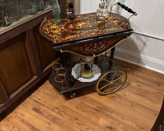 Italian dessert and beverage cart. Beautiful inlaid musical design. Excellent condition.
$800 obo