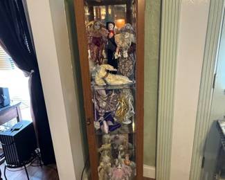 Cabinet is not for sale but many of the Harley Quinn dolls are. Please ask for info.