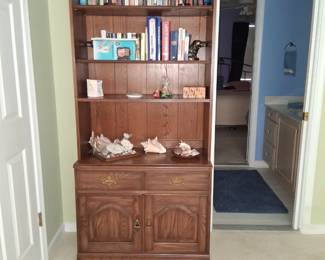 walnut book case with cabinet below
