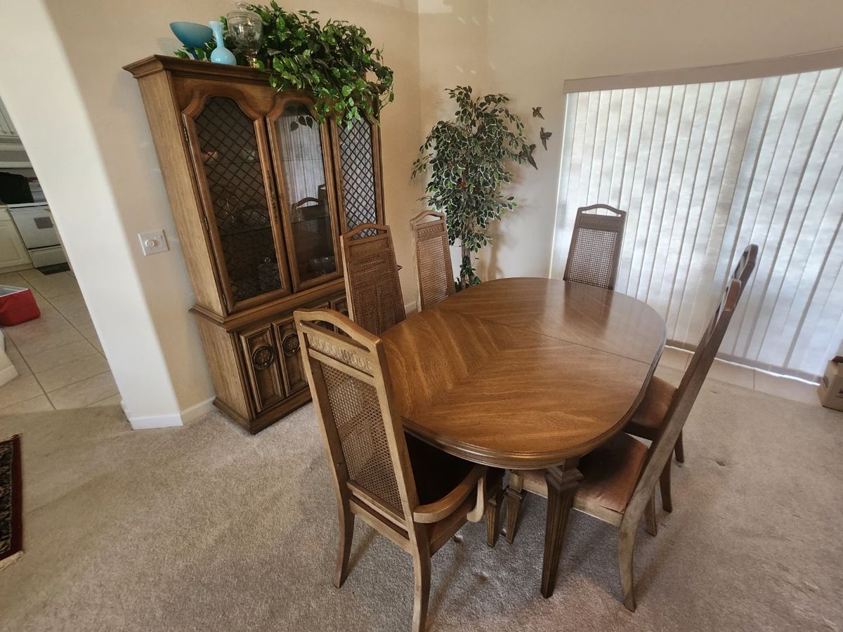 Solid wood Dining Set includes table, 6 chairs, extension leaf, China Cabinet, and table pad