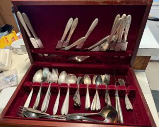 Silverware set for 12 (monogramed “K”)