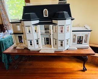 Handmade doll house with electric lights made by Ms. Angell. The house comes with the table that was built, especially for this house. There are thousands of miniatures in the sale. The items you see immediately following this picture are dollhouse miniatures. Many of them are by well known miniature artist.