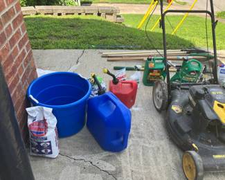 Lawn mower, various lawn and garden tools and chemicals.