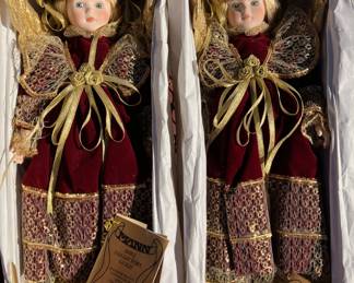 2 Seymour Mannvintage porcelain dolls in red velvet and gold. Have 2 of them. RARELY taken out of the boxes. PRISTINE condition!