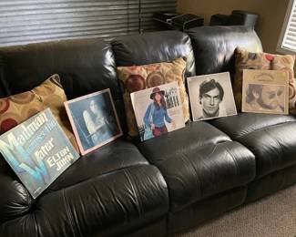 some of the Collectible Vinyl albums pictured on the Leather Sofa
