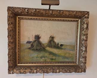 Antique oil painting. Haystacks in a field. No signature noted.