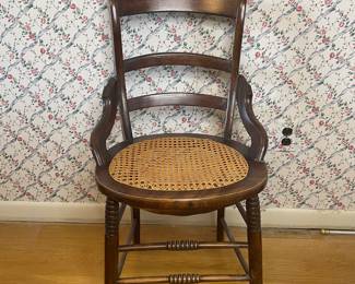Antique accent chair with caned seat