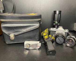 Nikon Nikkormat FT2 camera Nikon lenses, pistol grip, & flash gun.
Soligor tele-auto lens & leather camera bag