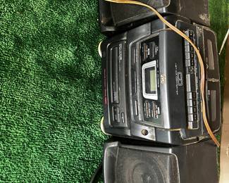 JVC PC-XC12 portable stereo system, which features a 3-CD changer, dual cassette decks, and an AM/FM radio tuner