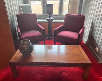 Two red easy upholstered chairs