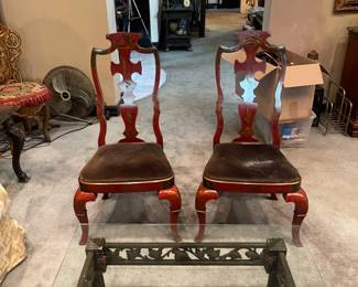 Chinoiserie splat back red lacquered finished upholstered cushions.