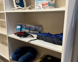 irons, umbrellas, new scale, and neck pillow