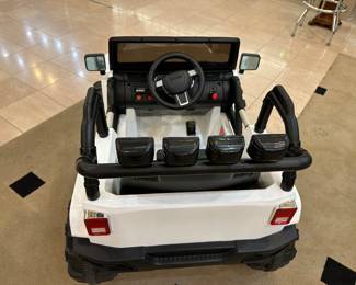 This child's Jeep is like new - looks as though it's never been used. Charger and remote included.