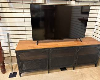 Love this metal tv stand - 3 doors to open