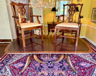 SOLD; dining room table and chairs; table has lighter colored veneer trim, with 2 leaves; 2 arm chairs (as shown) and 6 side chairs; both table and chairs have some condition issues; table: 80"x40"x30" plus 2 20" leaves making the full table 120"