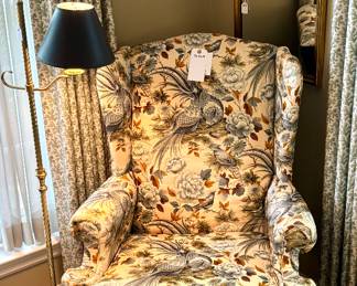 ($300; custom upholstered wingback chair by Burlington with avian and botanical details; 32x28x44)  (SOLD; brass floor light with black shade; 54'h)