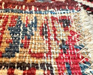 $850; hand-knotted wool rug with blues and reds; 8'x6'; close up view of the knotting